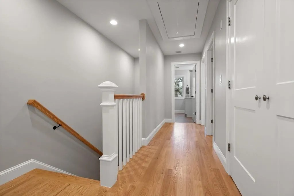 Finish carpentry stair railing and hallway trim work in Wakefield, MA