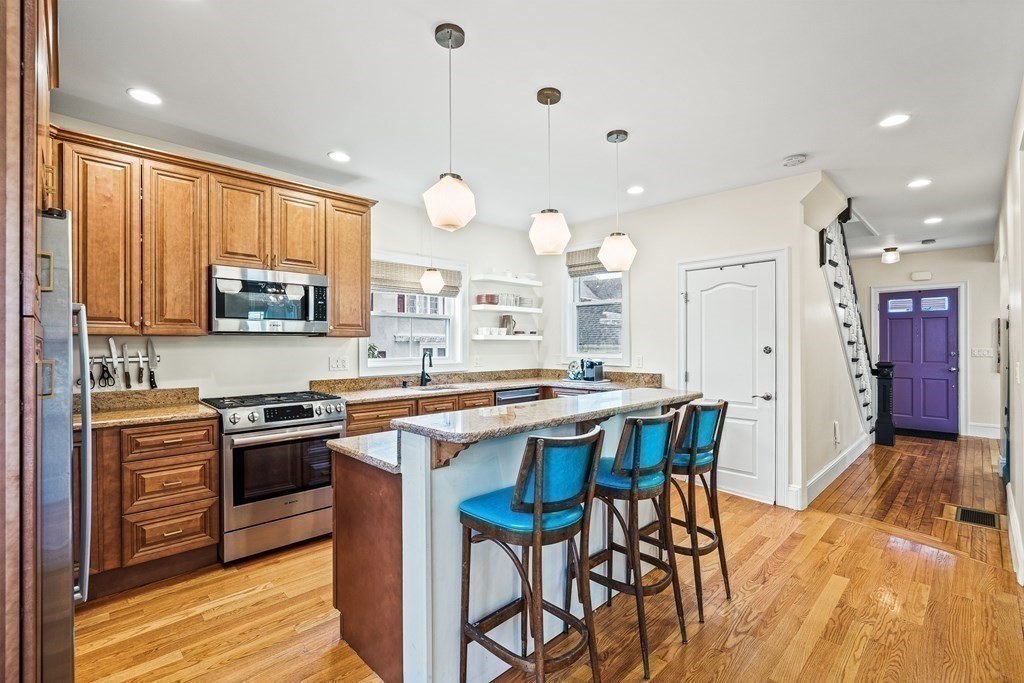 Kitchen range wall with custom cabinetry in Melrose, MA