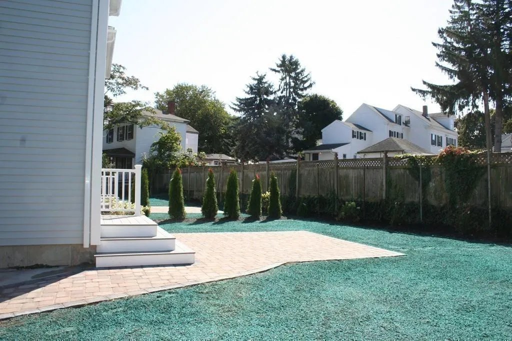 Paver walkway and landscaped rear yard in Wakefield, MA