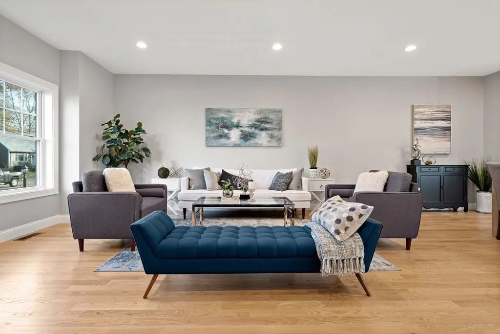 Bright living room with oversized windows in the Wakefield, MA renovation