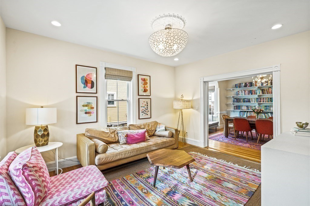 Living room with custom built-ins and hardwood floors in Melrose, MA