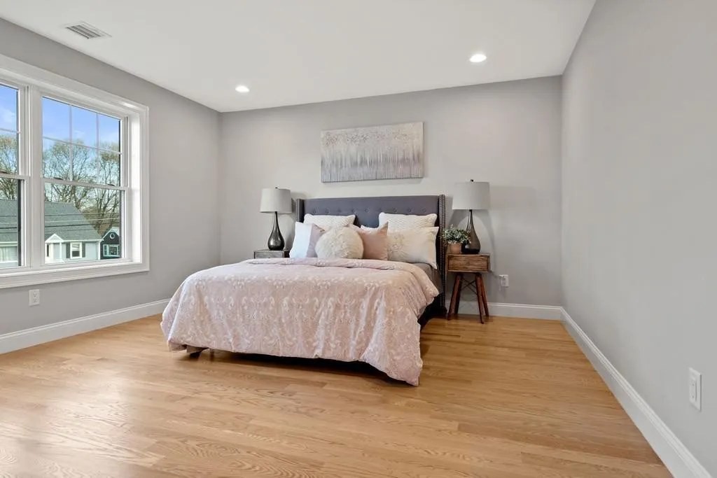 Guest bedroom with hardwood floors in Wakefield, MA